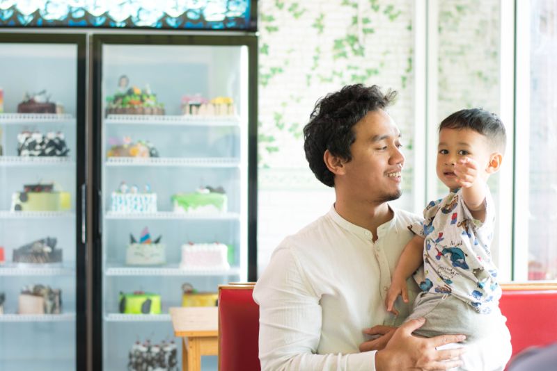 father and son in bakery