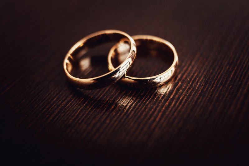 a pair of gold rings on a table