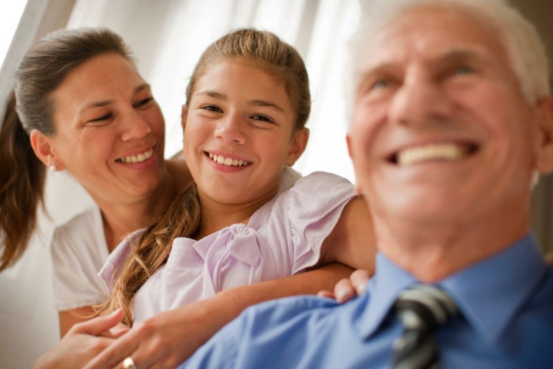 Wealthy looking smiling family at home