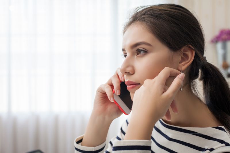 Woman on a phone call listening intently