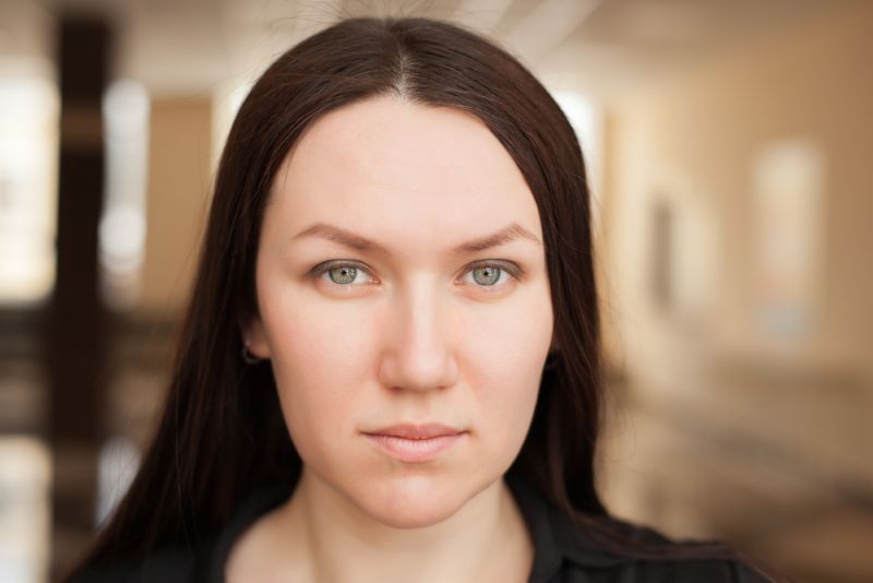 Pale middle aged woman with a serious expression on her face